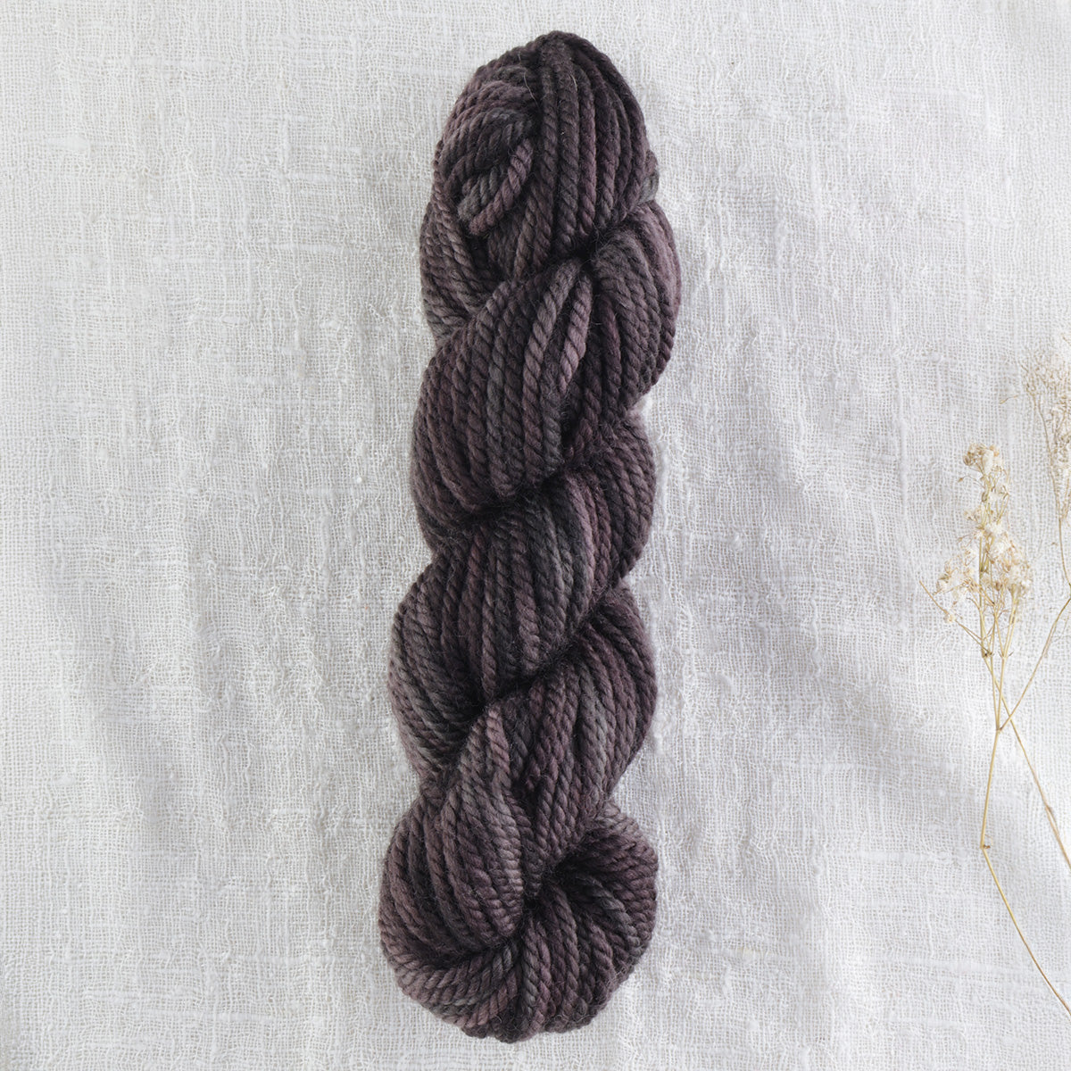 Skein of variegated Black Rhino rug weight punch needle wool yarn