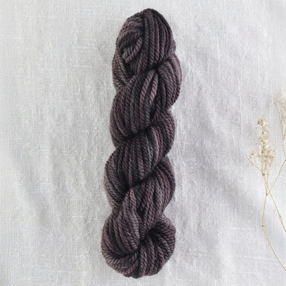 Skein of variegated Black Rhino rug weight punch needle wool yarn