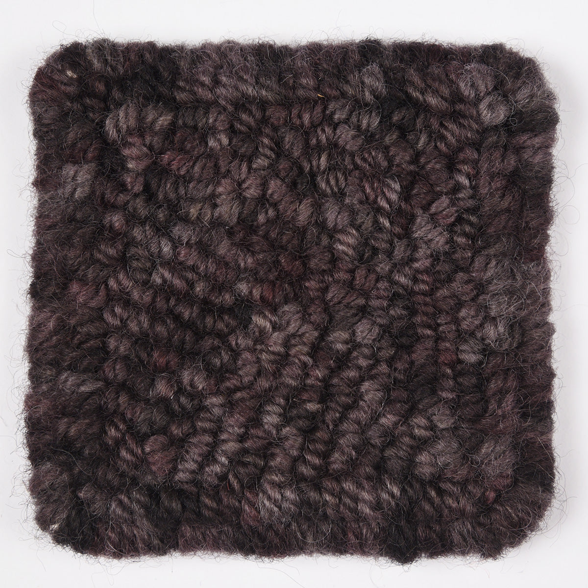 Skein of variegated Black Rhino rug weight punch needle wool yarn