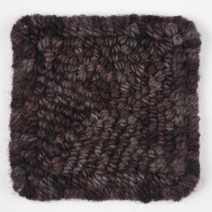 Skein of variegated Black Rhino rug weight punch needle wool yarn