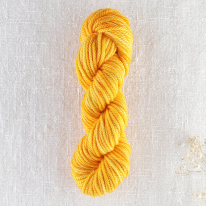 Skein of variegated Florida Juice rug weight punch needle wool yarn