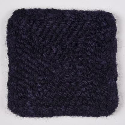 Skein of variegated Blackberry rug weight punch needle wool yarn