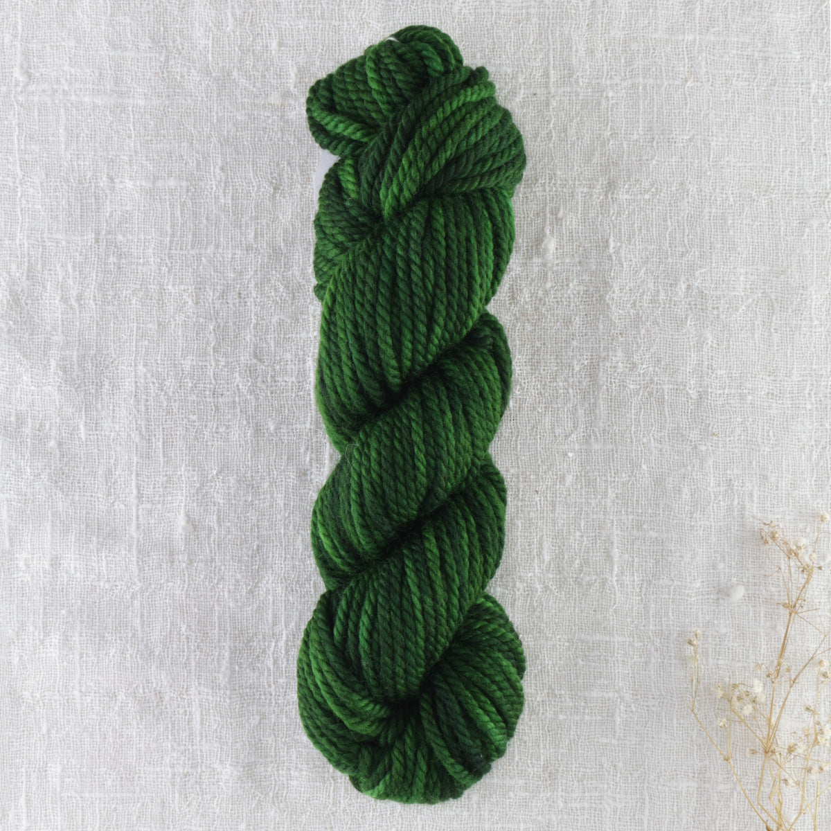 Skein of variegated Club Moss Dark rug weight punch needle wool yarn