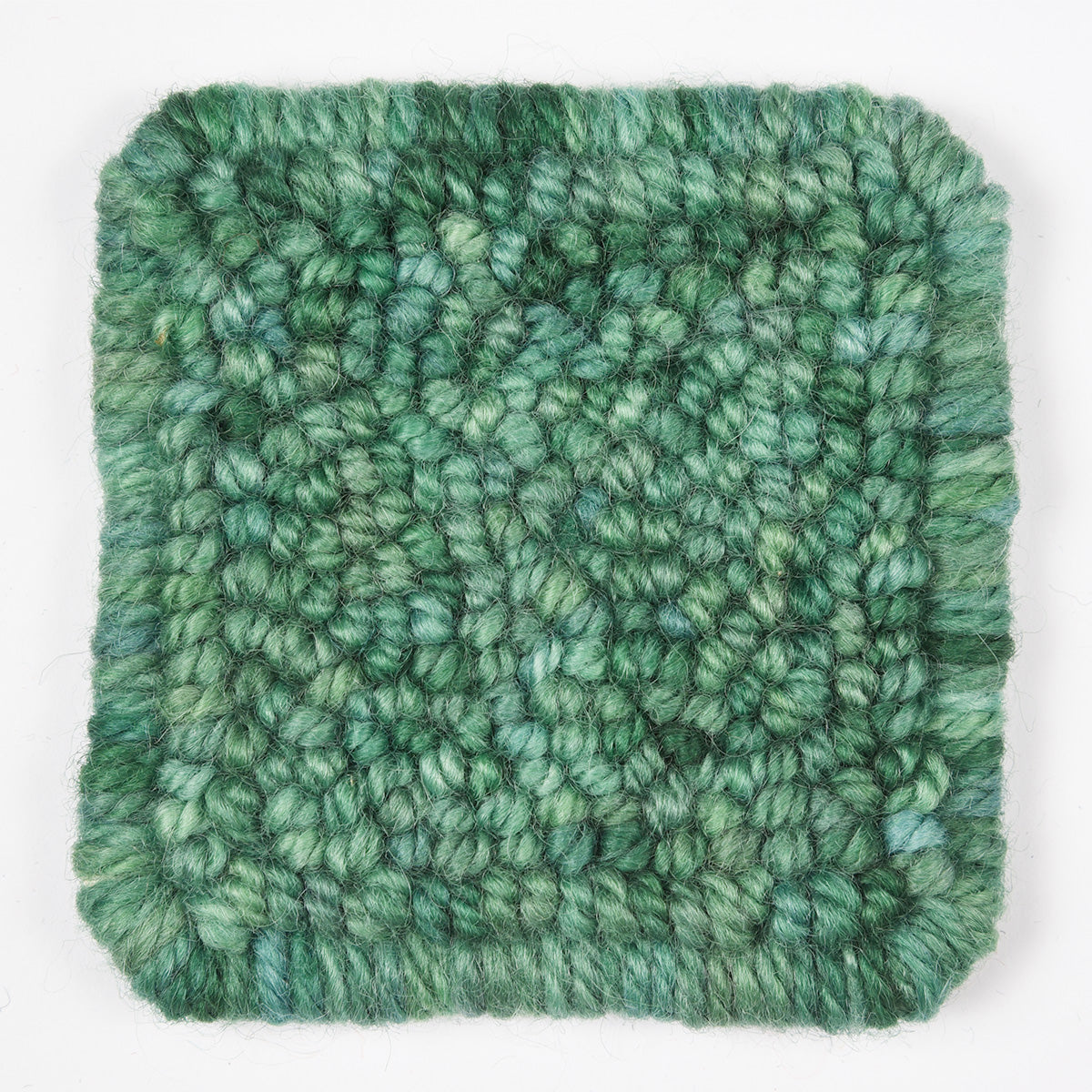 Skein of variegated Club Moss Light rug weight punch needle wool yarn