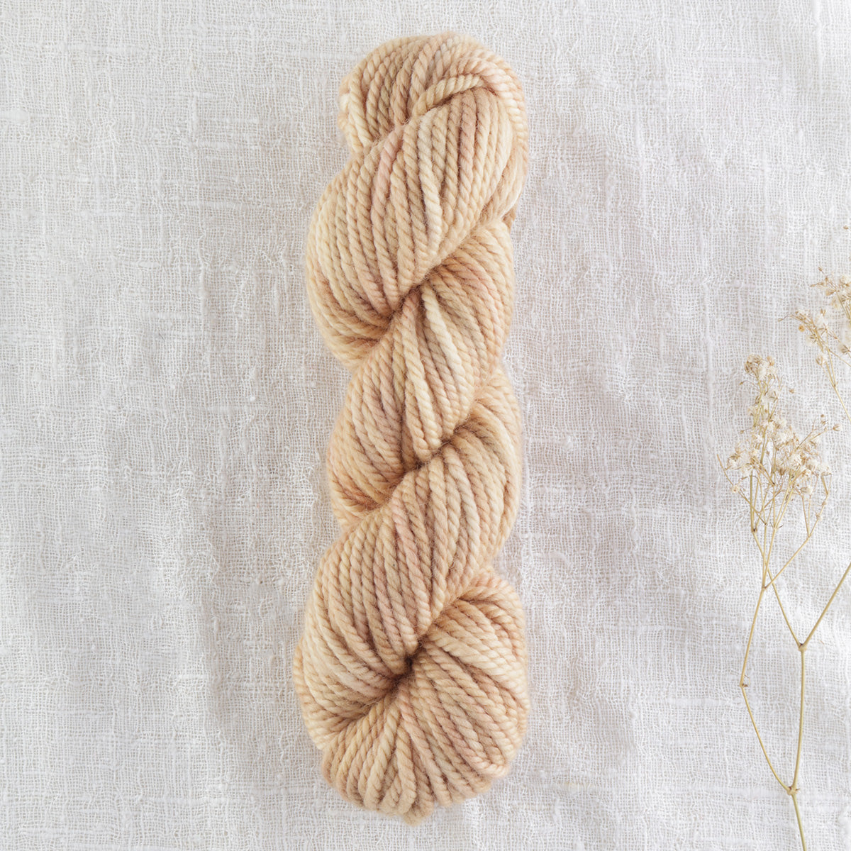 Skein of variegated Desert Sands rug weight punch needle wool yarn
