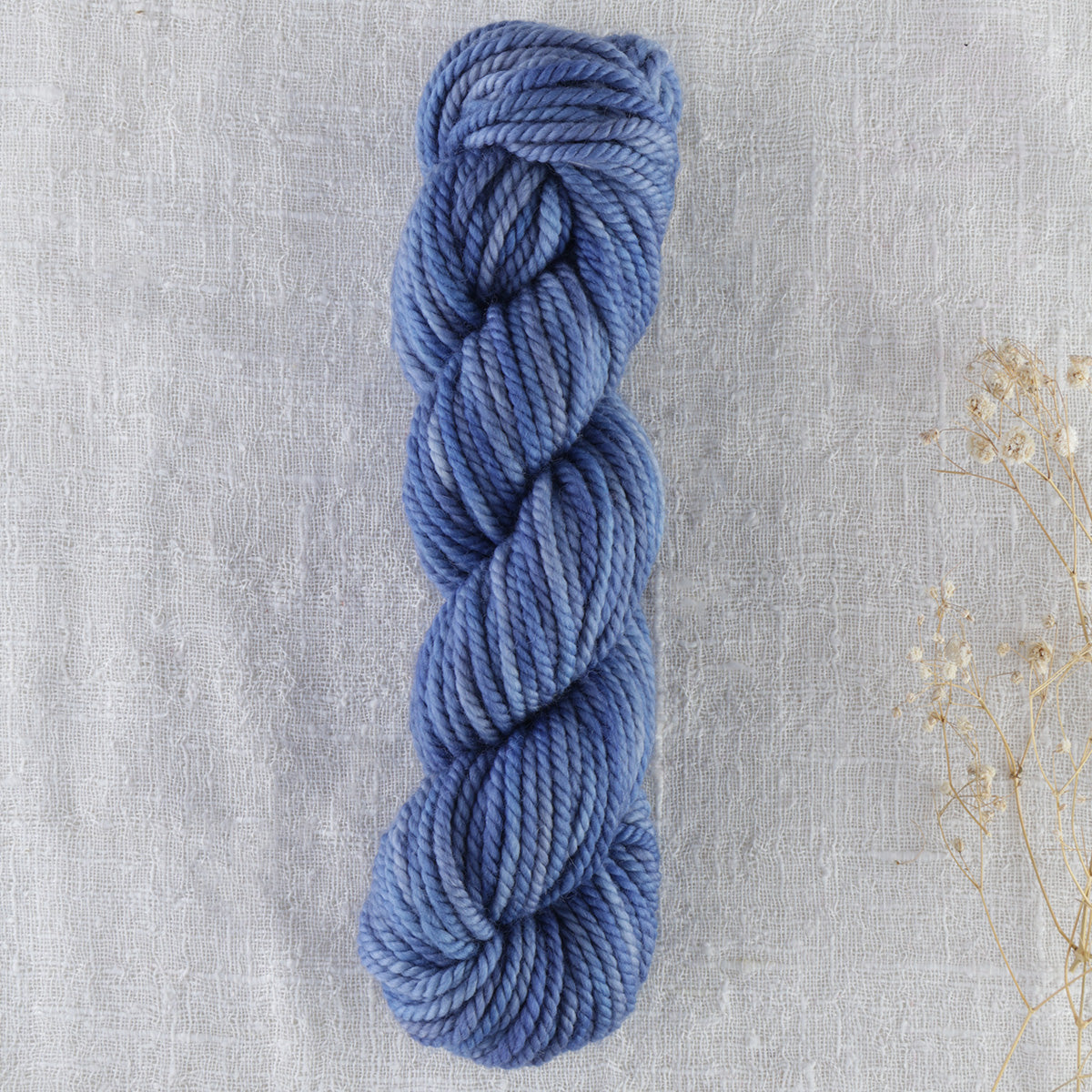 Skein of variegated Lobelia rug weight punch needle wool yarn