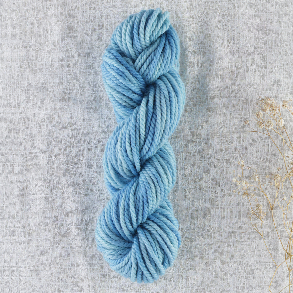 Skein of variegated Open Sky punch needle rug yarn