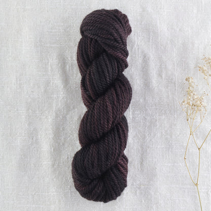 Skein of variegated Black Hollow rug weight punch needle wool yarn