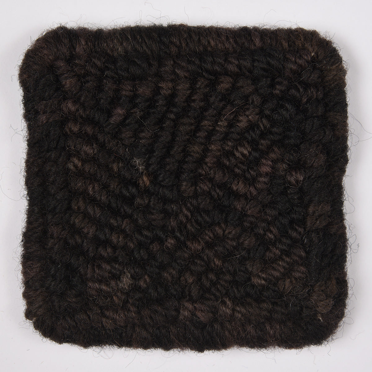 Skein of variegated Black Hollow rug weight punch needle wool yarn