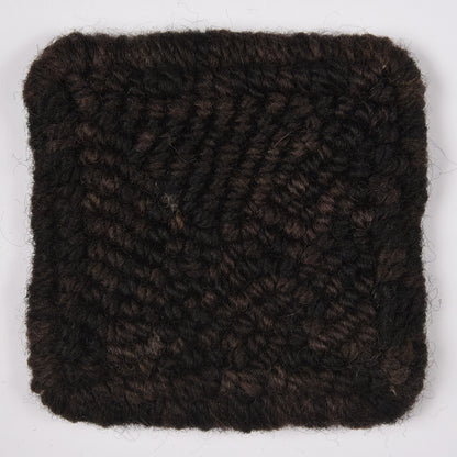 Skein of variegated Black Hollow rug weight punch needle wool yarn