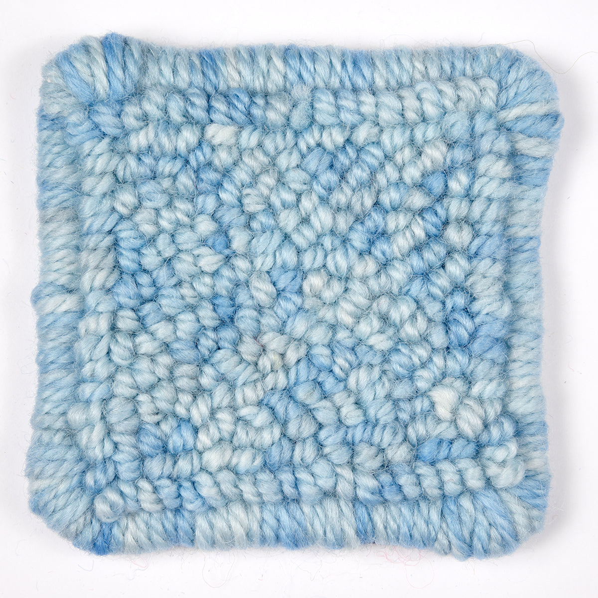 Skein of variegated Eye On The Sky rug weight punch needle wool yarn