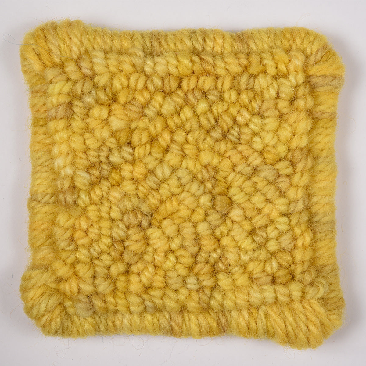 Skein of variegated Lemon Zest rug weight punch needle wool yarn