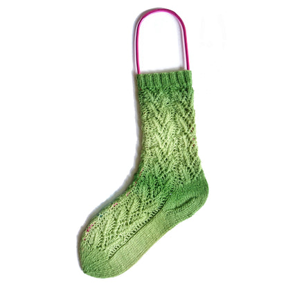 Red anodised aluminium sock blocker in a foot shape