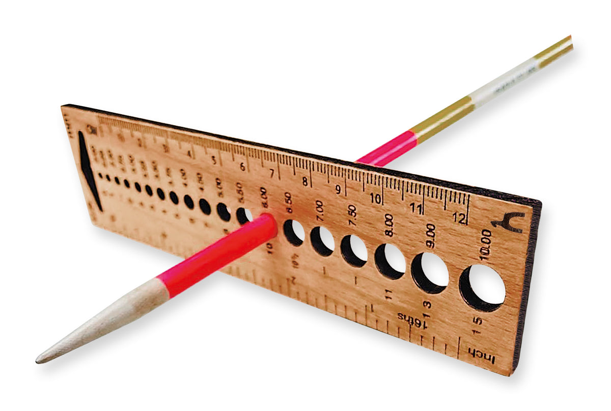 Rectangular wooden knitting gauge with needle holes and ruler markings
