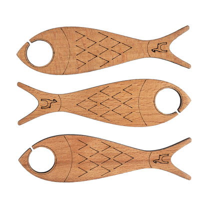 Three fish shaped wooden yarn bobbins