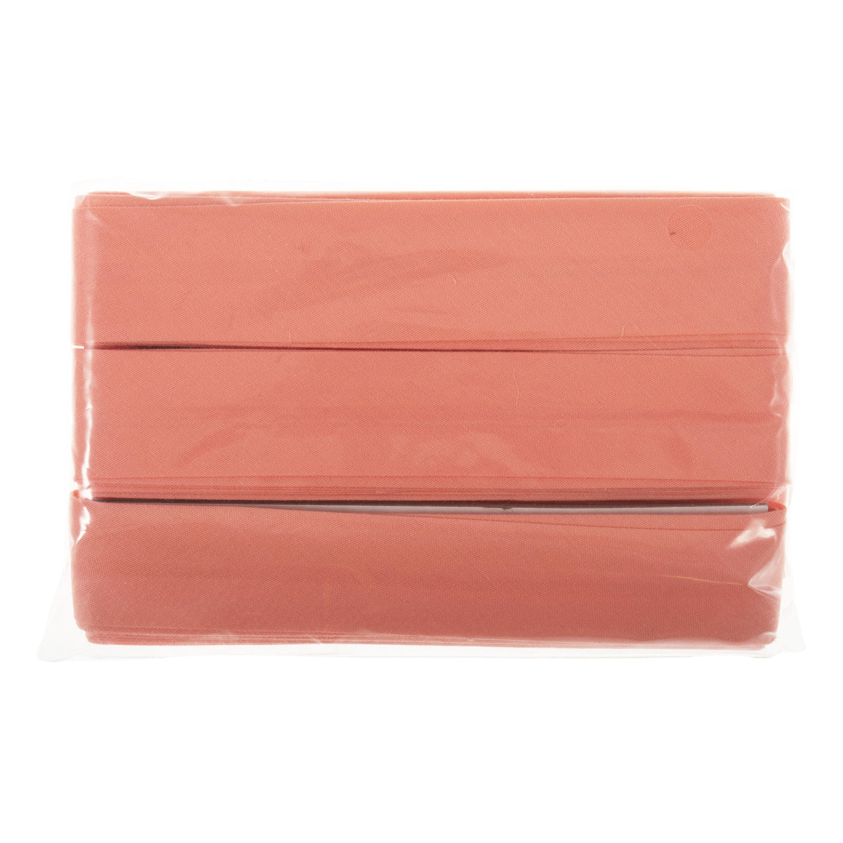 Coral polycotton bias binding wound on a card