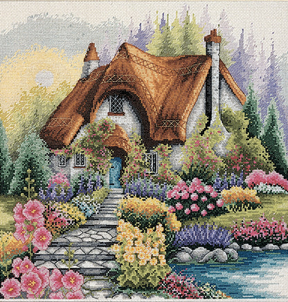 Anchor Lakeside Cottage cross stitch kit showing a cottage by a lake