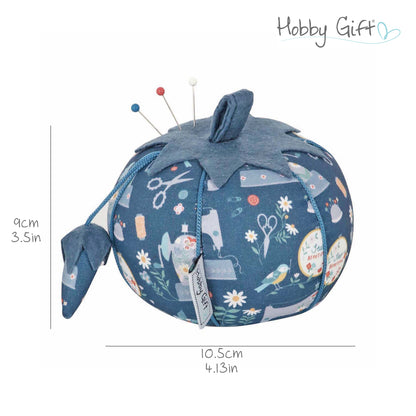 Tomato pincushion in a sewing machine print fabric