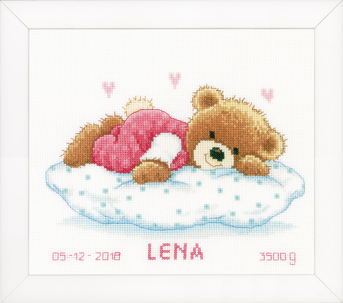 Cross stitch birth record with a sleeping teddy bear