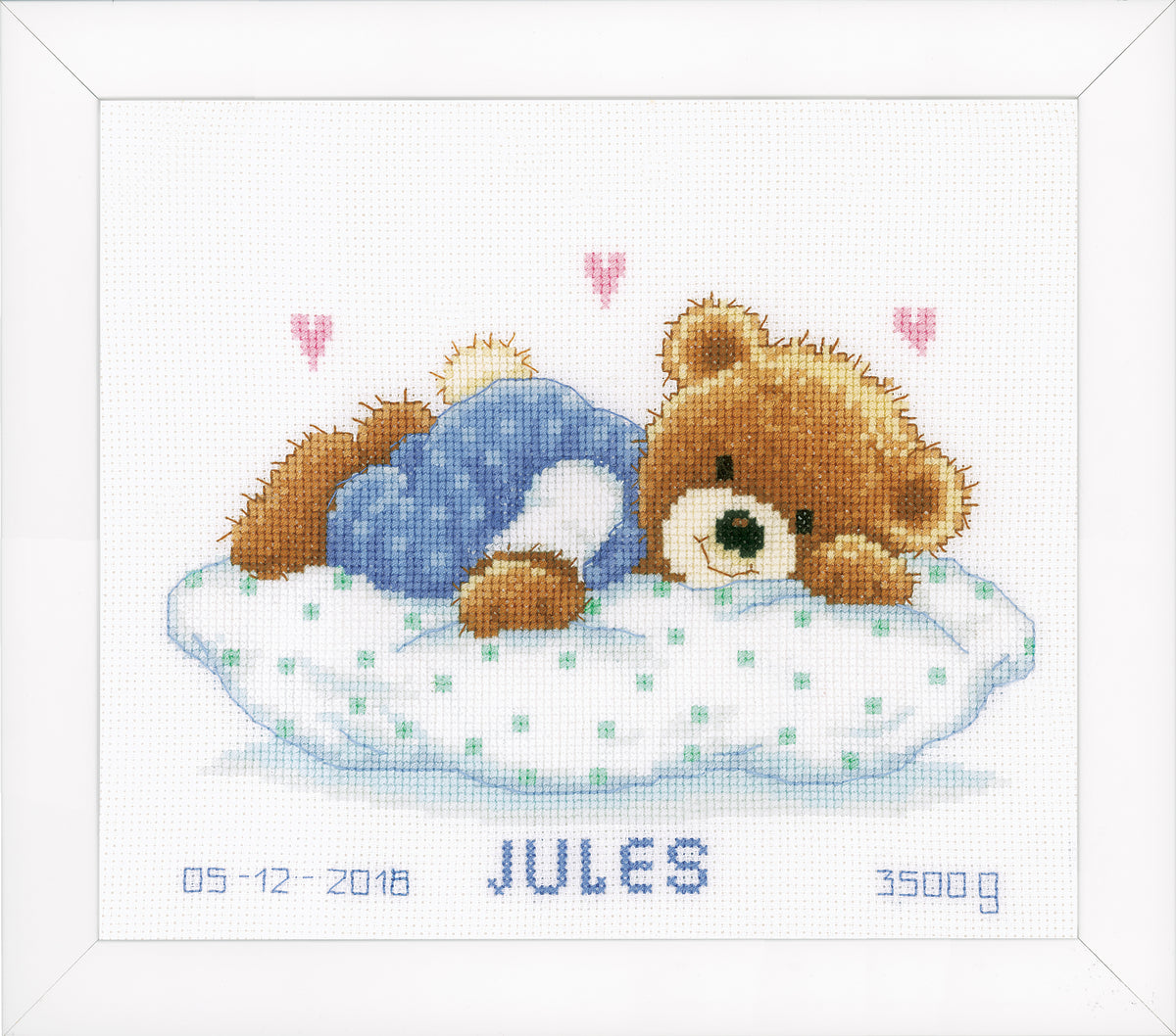 Cross stitch birth record with a sleeping teddy bear