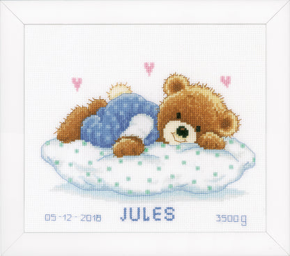 Cross stitch birth record with a sleeping teddy bear