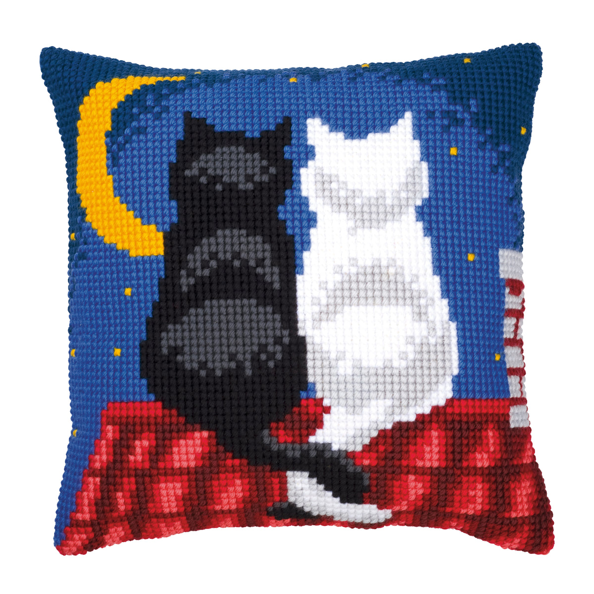 Finished cross stitch cushion showing cats on a rooftop