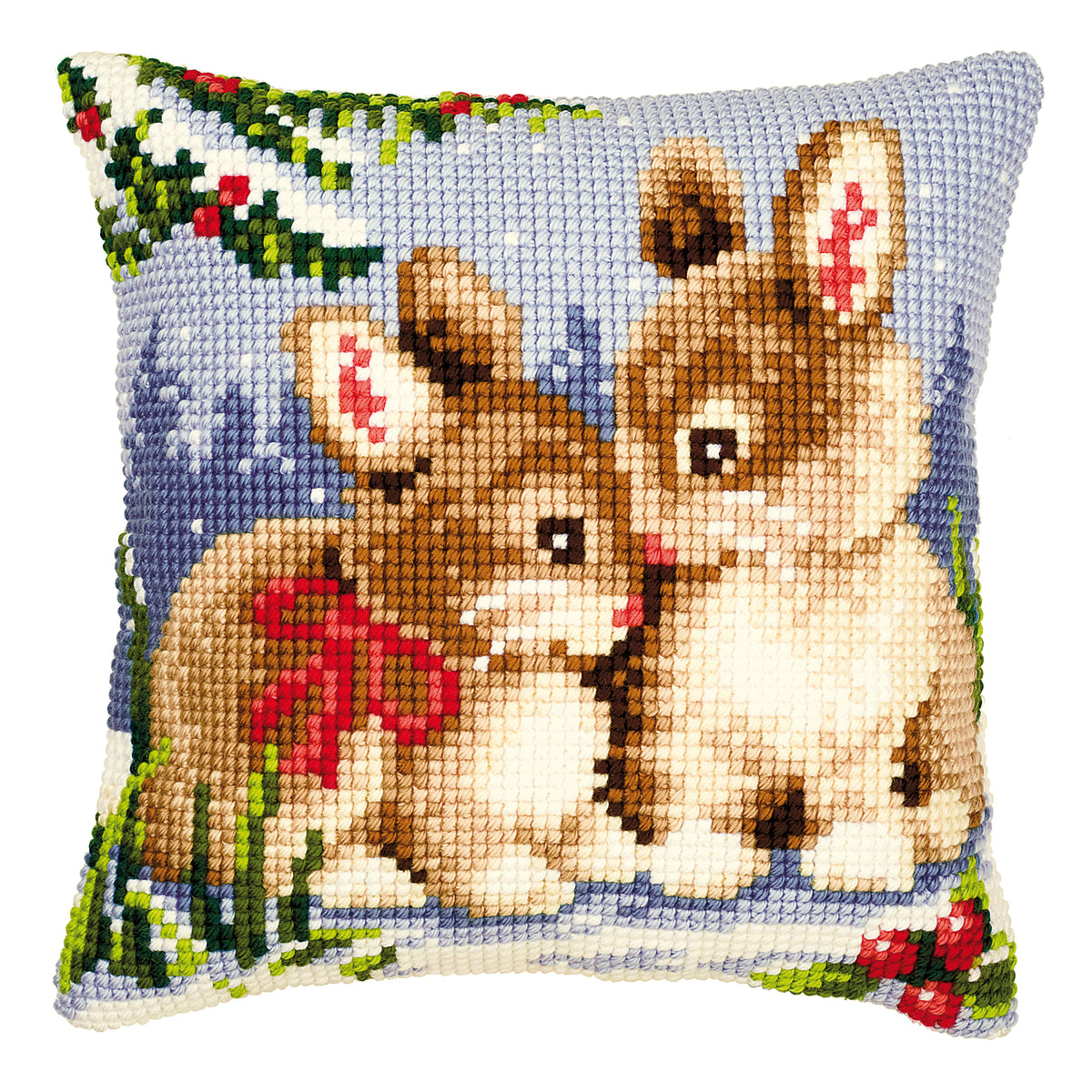 Finished cross stitch cushion showing bunnies in a winter scene