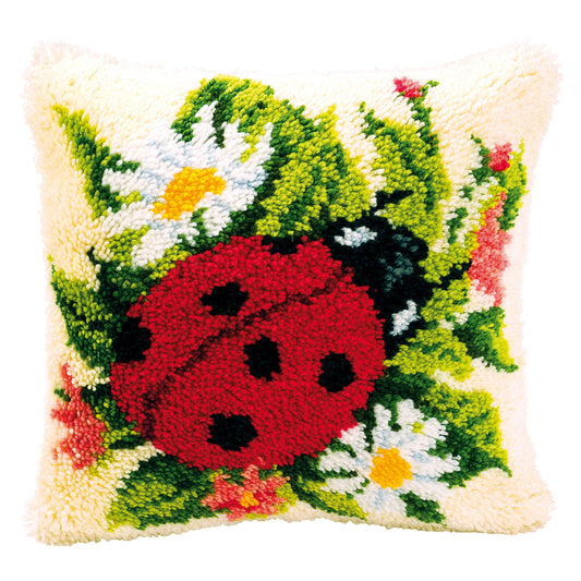 Latch hook cushion with a ladybird design