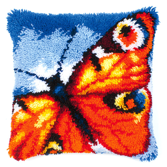 Latch hook cushion with a butterfly design