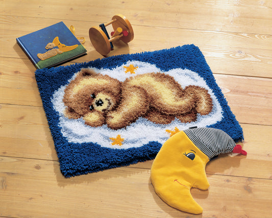 Finished Vervaco latch hook rug with a sleeping teddy on cloud design