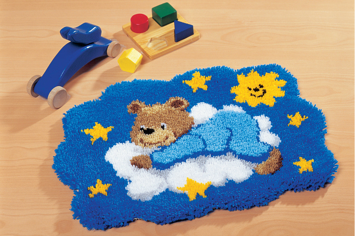 Finished Vervaco latch hook rug with a bear on cloud design