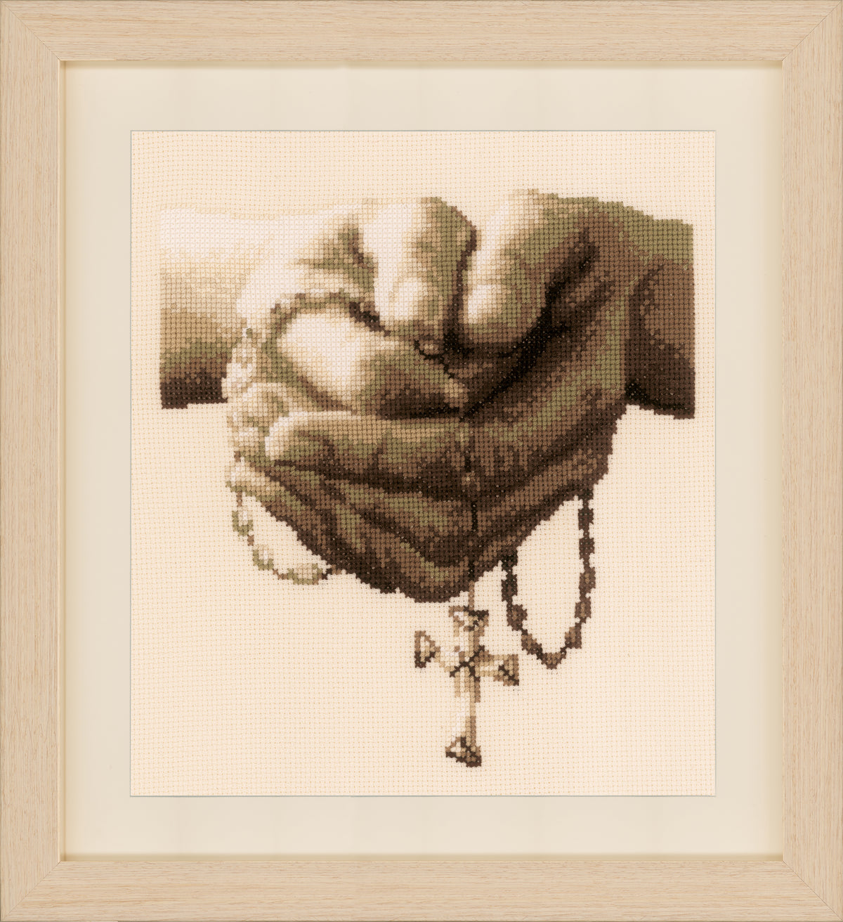 Cross stitch of a praying figure