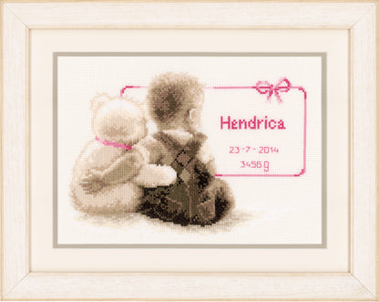 Cross stitch birth record with a cuddling teddy bear