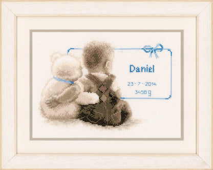Cross stitch birth record with a cuddling teddy bear