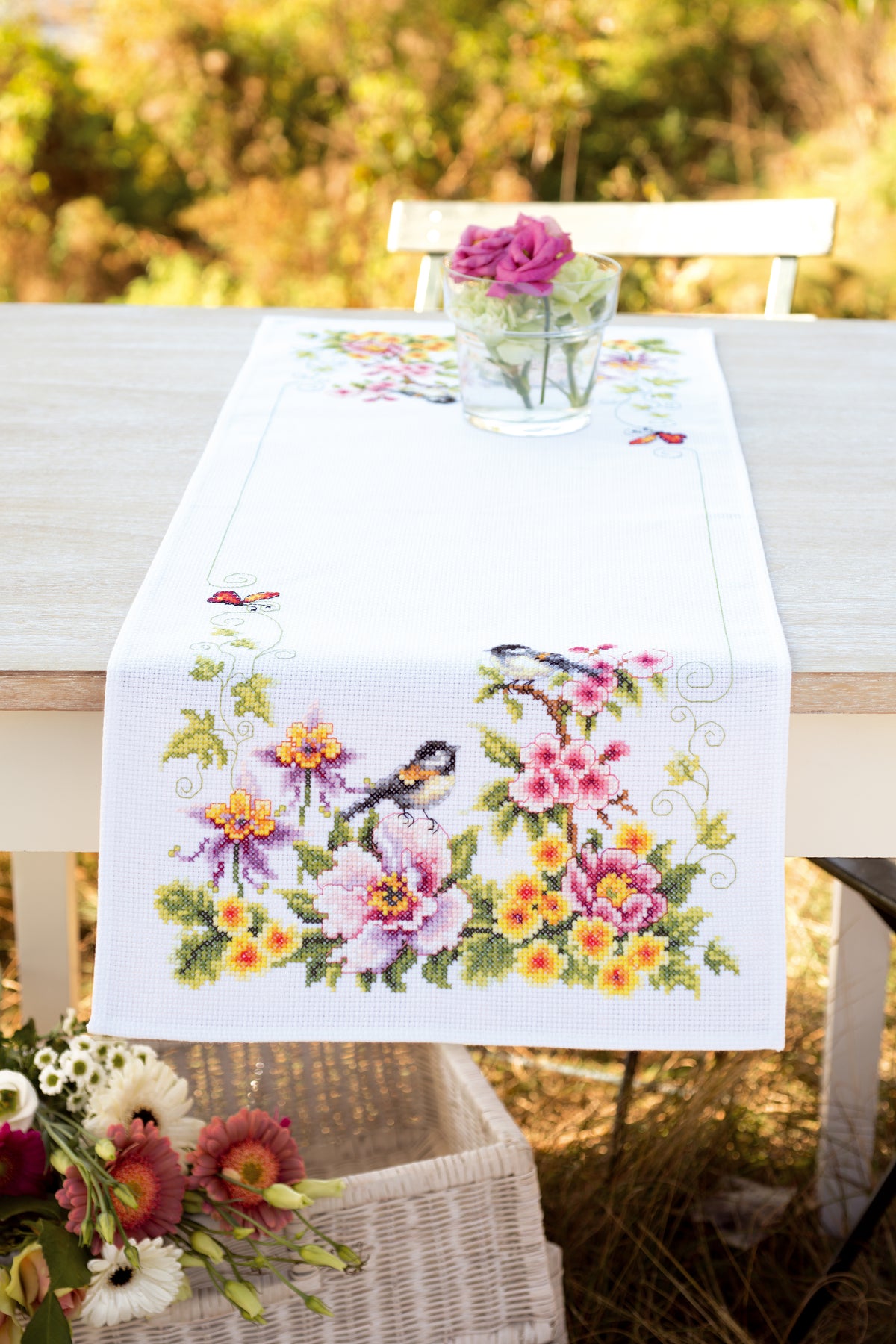 Cross stitch table runner with a spring design
