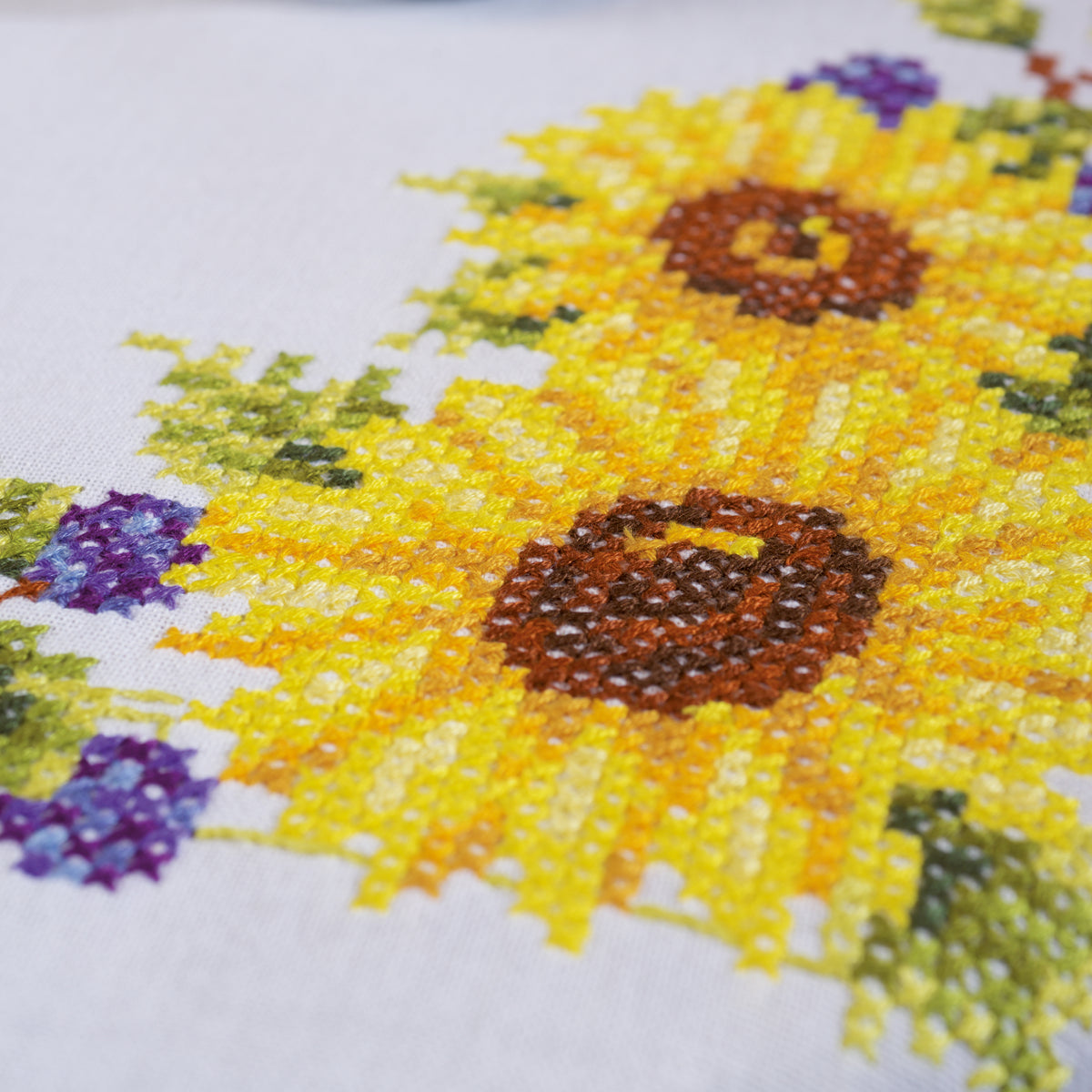 White square tablecloth embroidered with sunflowers