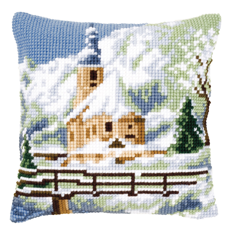 Cross stitched cushion with an alpine scene
