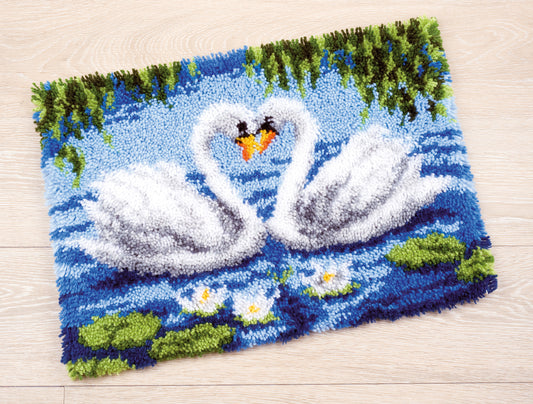 Latch hook rug with a swans design