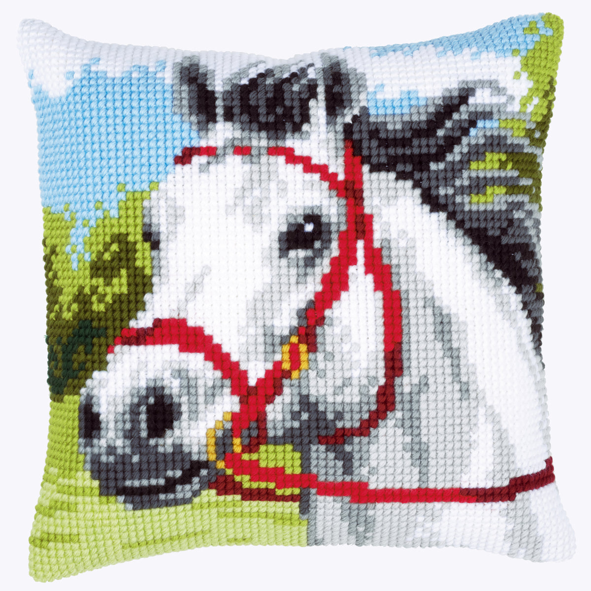 Finished Vervaco cross stitch cushion showing a white horse