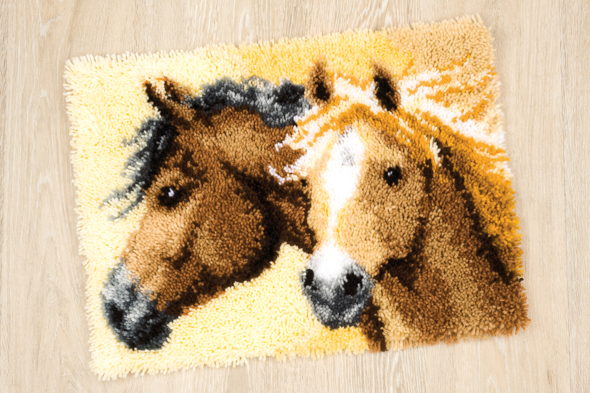 Finished Vervaco latch hook rug showing horses