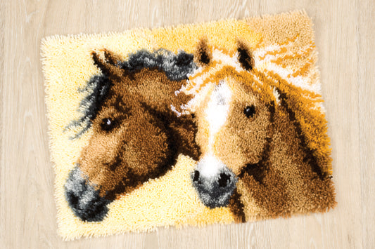 Finished Vervaco latch hook rug showing horses