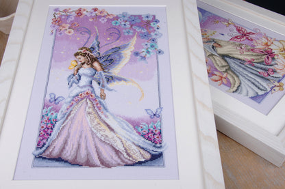 Cross stitched fairy picture on purple fabric