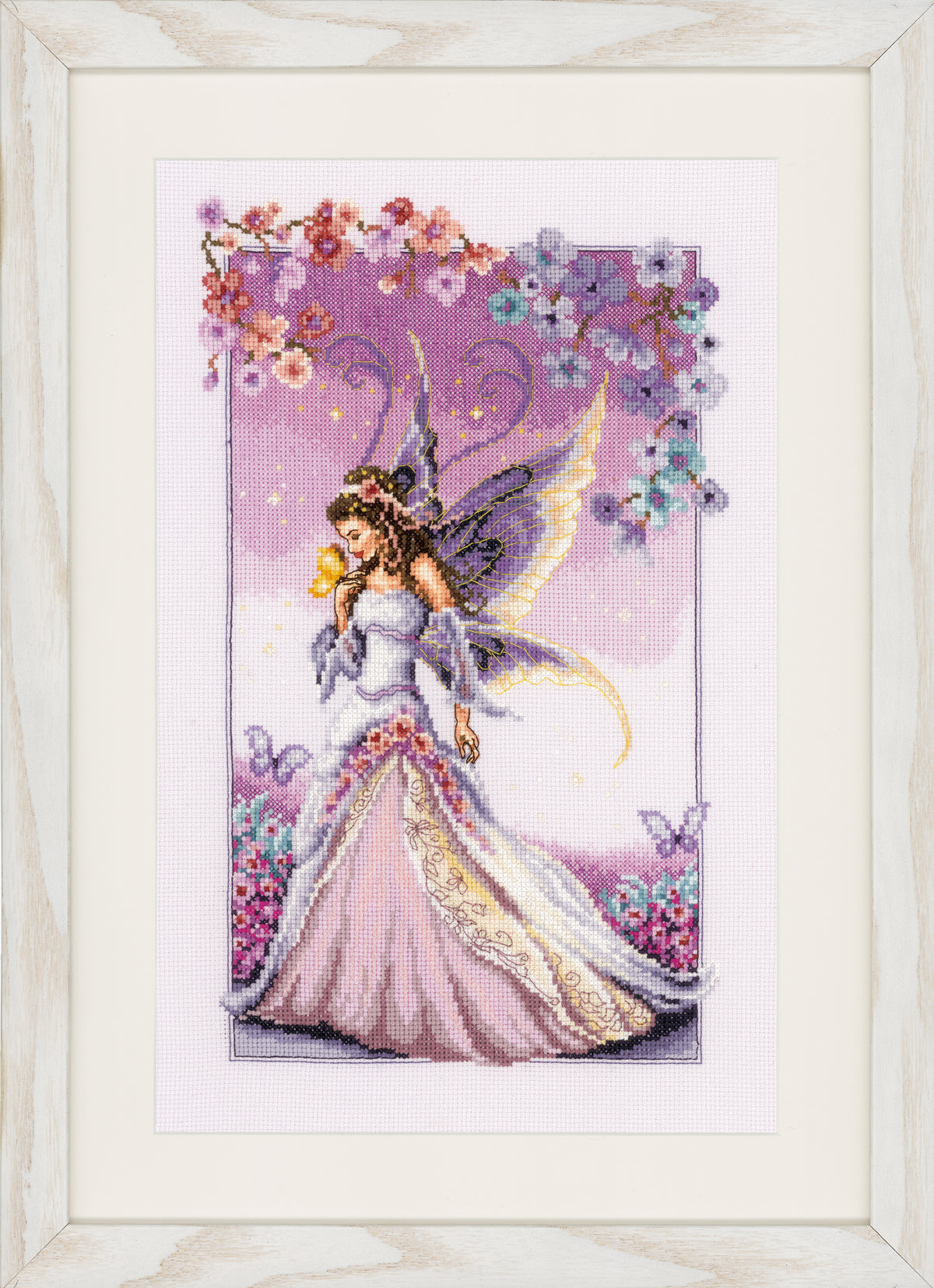 Cross stitched fairy picture on purple fabric