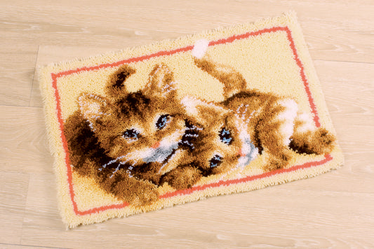 Latch hook rug showing kittens