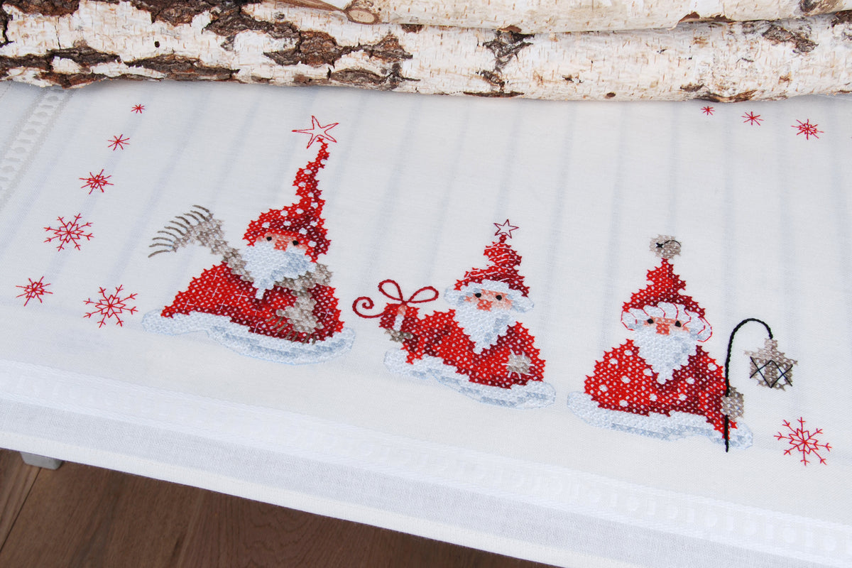 Embroidered table runner with Christmas gnomes design
