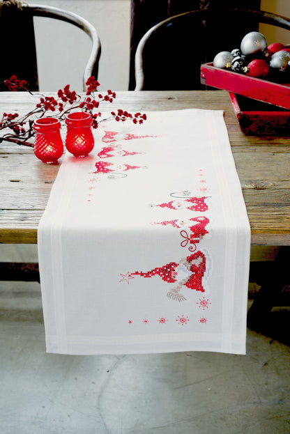 Embroidered table runner with Christmas gnomes design