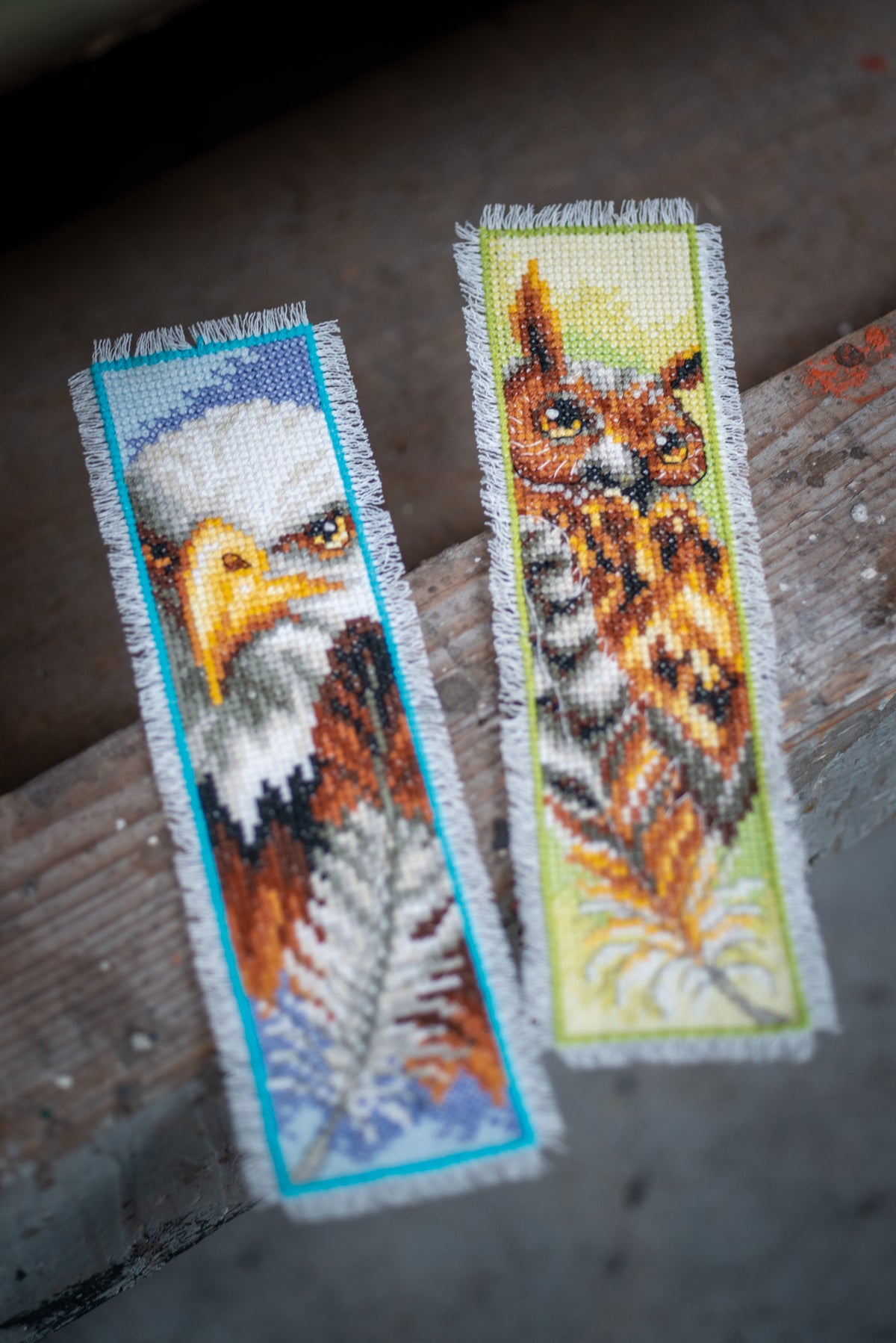 Two cross stitch bookmarks showing an eagle and an owl