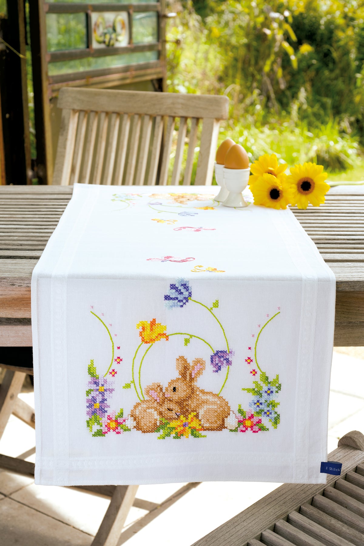 Embroidered table runner with rabbits design
