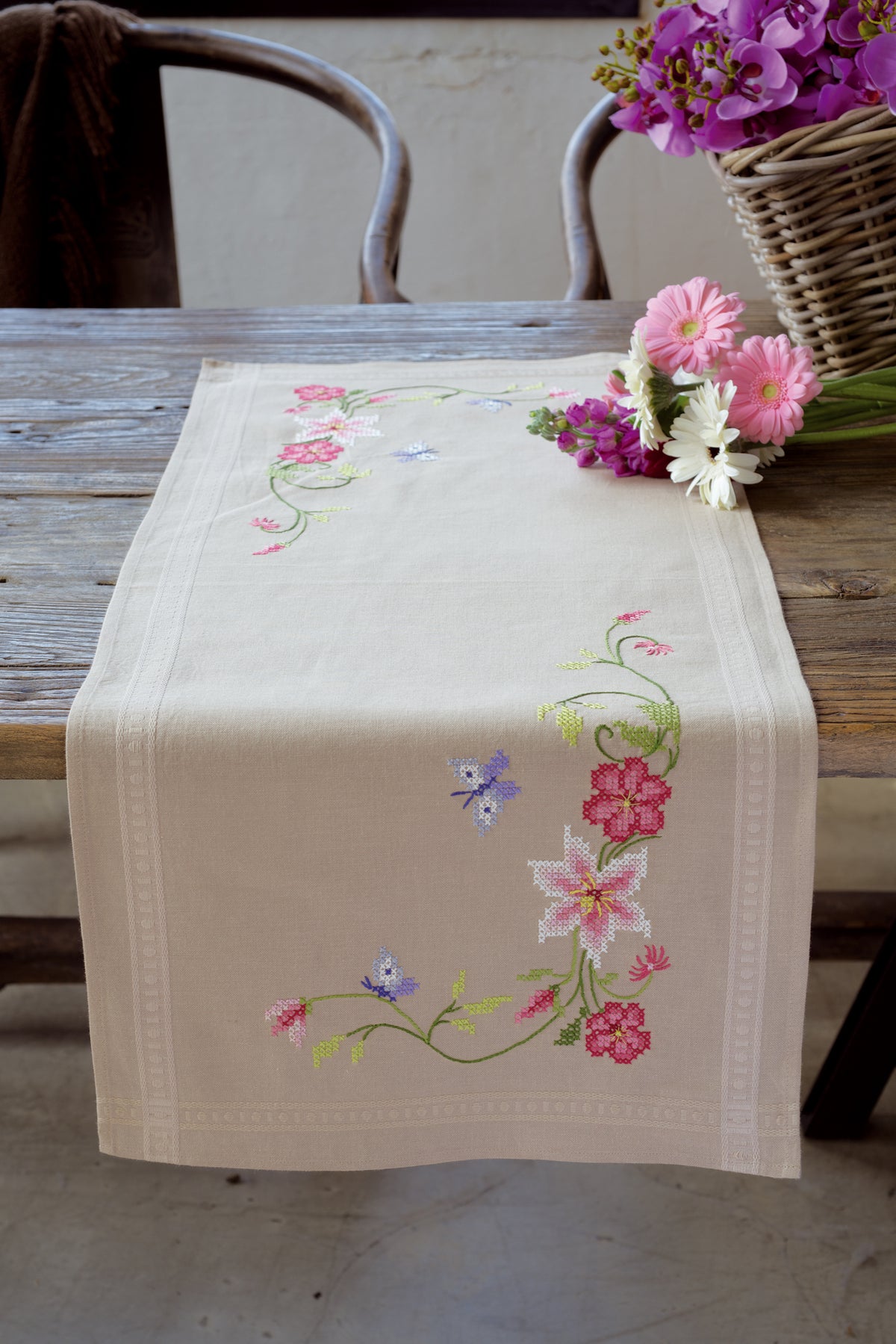 Embroidered table runner with flowers and butterflies design