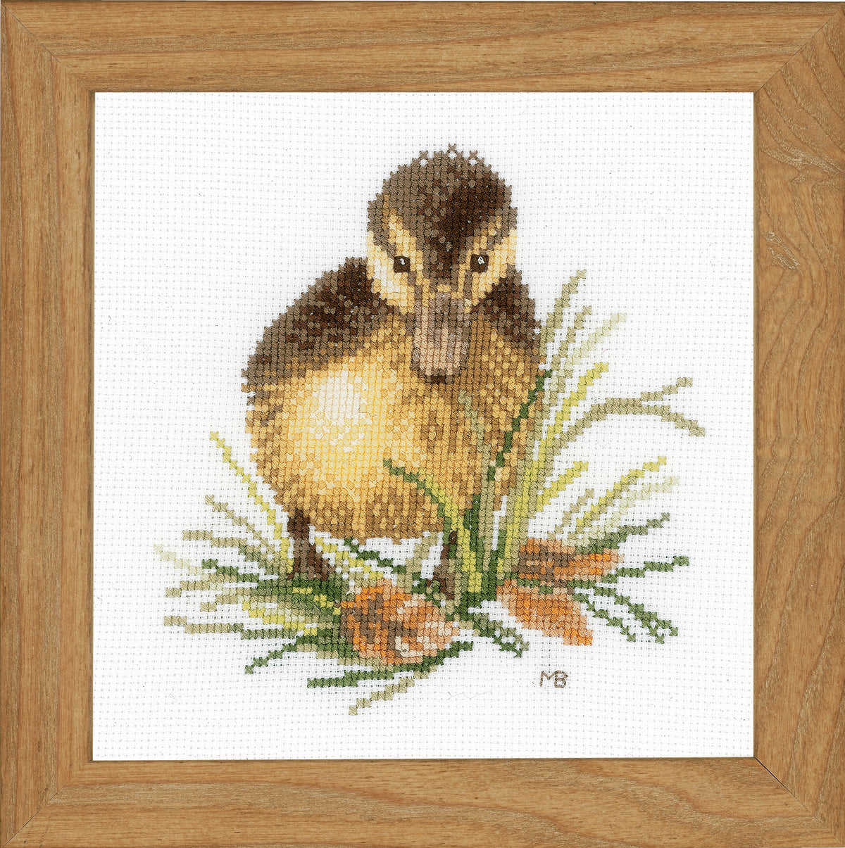 Cross stitched picture of a small yellow duckling